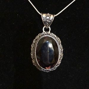 Oval amethyst necklace on 18 inch snake chain set in sterling silver stamped 925